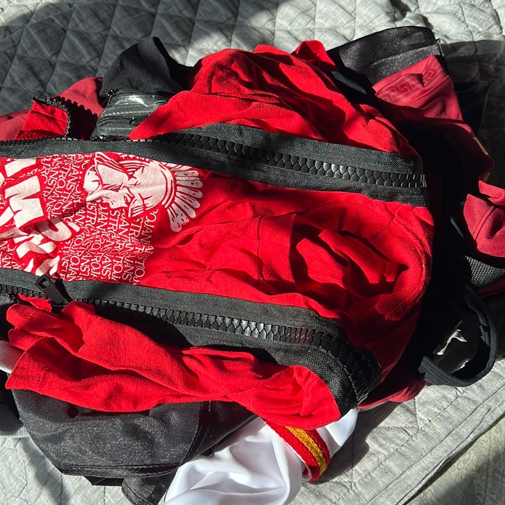 USC school gear (3 tshirts, 2 bandeaus, 1 skirt , 1x socks, 1 flag, 1 bag)